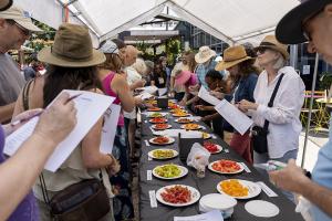 Participants gather at the sampling table