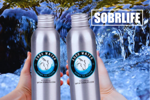 Dual SOBR WATER bottles in hand shows the concept of SOBR WATER is a new premium artesian water from SOBRLIFE