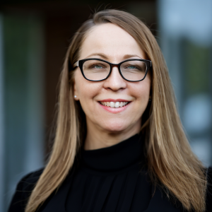 professional photo of Leah Jaramillo, the Director of Learning & Development for Austin Alliance Group