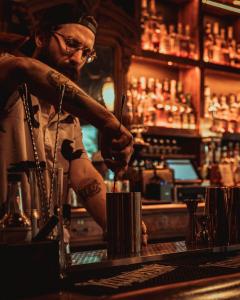 Image of a bartender at Neat making a drink