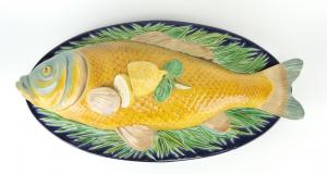 Circa 1875 Minton majolica tureen, the cover formed as a large carp with a lemon forming the handle, 7 inches in height and 23 inches long (est. $8,000-$12,000).