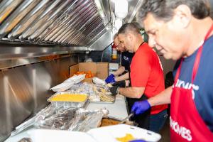 Misha Ezratti’s GL Homes volunteers prepare meals in the Meal Mobile kitchen as part of a collaboration with The Lord’s Place to combat homelessness in Palm Beach County, focusing on communities in Belle Glade and Riviera Beach. The initiative aims to pro