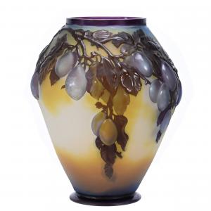 Lot 220 is a signed Galle French cameo art glass Souffle vase in the rare mold brown plum design, having frosted white and yellow ground with purple cameo cutback overlay (est. $8,000-$12,000).
