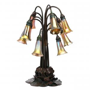 Original bronze Lily Pad 12-light lamp marked Tiffany Studios, all 12 gold favrile shades marked “LCT”, 20 inches tall, with fantastic patina and original switch hardware (est. $15,000-$20,000).