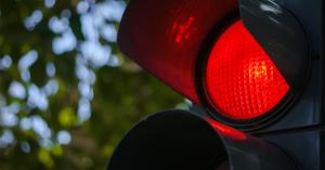 traffic light up close with the red light bright