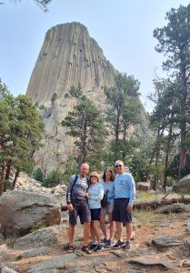 Photo of 4 hikers at Devil's Tower in Wyoming for Sophia's Stroll.