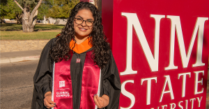 Portrait of NMSU Global Alum Jessica Garcia dressed in cap and gown