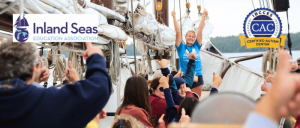 A gathering of people aboard a boat, engaging in conversation and enjoying the scenic views around them.