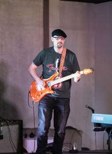 David Lazar dazzles on lead guitar at Springboard Houston's main stage.