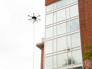 Lucid Bots Sherpa Drone Cleaning. the Exterior of a University Building.