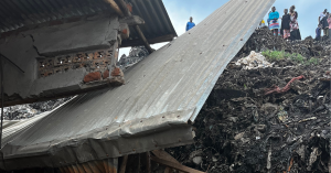 Residents grieve and survey the damage from the Kiteezi dumpsite landslide in Uganda.