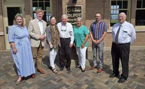 The "River Room" was newly designated on August 2, 2024 with a plague at the historic train depot on Broadway Street in Downtown Natchez. From Left to Right: Sarah Lindsey Laukhuff, Mayor Dan M. Gibson, Nancy and Warren Reuther, Natchez Alderwoman Ward 1 Va