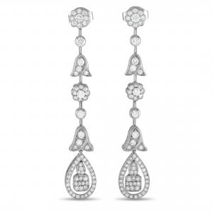 Pair of Graff platinum tulip chandelier earrings. Dropping from the earlobe is a 2 ¾ inch long platinum strand with floral motif and 3-carat diamond embellishment (est. $13,500-$20,000).