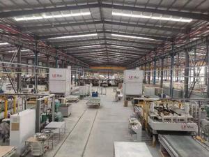 Expansive view of the LE Surfaces factory, showcasing multiple production lines and equipment used in quartz manufacturing.