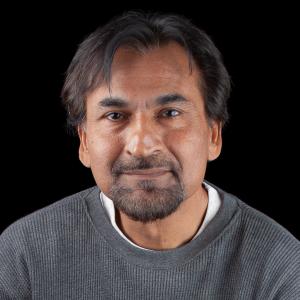 A headshot of the author Zak Karamally