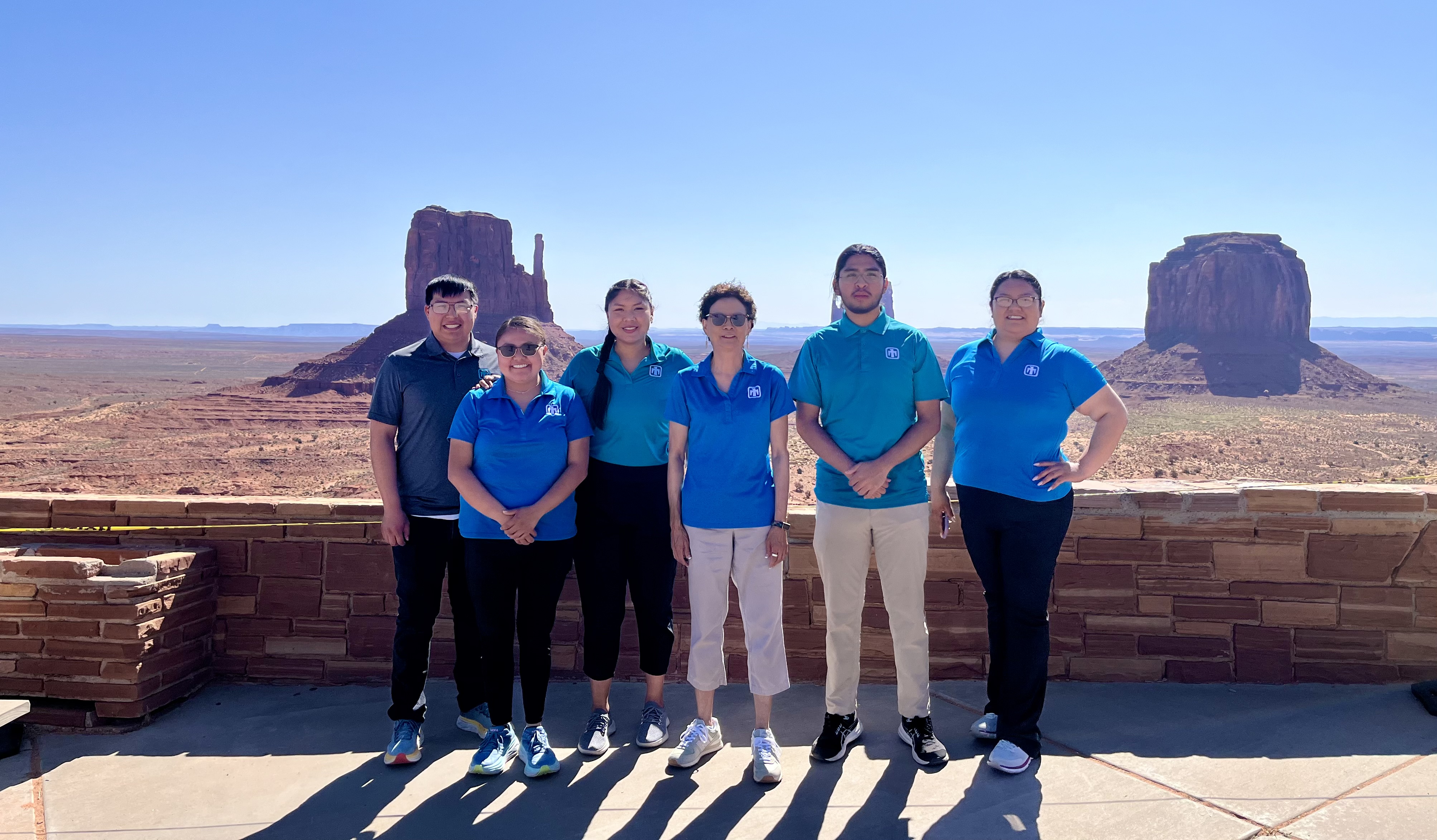 Sandra Begay standing with her interns at Navajo Nation, Monument Valley, mentoring future Native American STEM leaders.