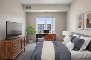 Carpeted bedroom with a large window view