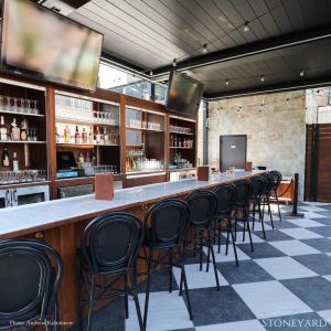 Vintage Green rooftop bar with Stoneyard Newport Mist Square and Rectangular accent wall.