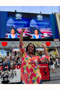 Amb. Dr. Mrs. Catherine Agionomoisi Utsalo - featured on Times Square