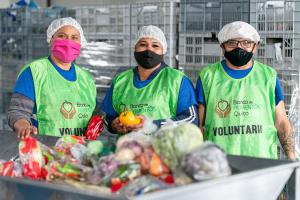 Image shows three workers sorting donated food at a food bank in Quito, Ecuador, where the methodology was piloted.