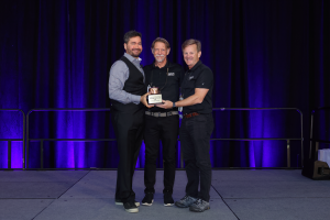 Erik Owens Presents Distillery Of The Year Award To St. Augustine Distillery