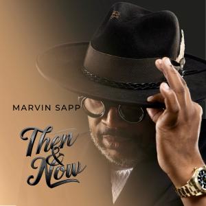 Marvin Sapp wearing a black fedora hat, tips it with his hand, wearing a watch. The background gradient transitions from dark to light brown. Overlaid text reads ‘Marvin Sapp’, followed by ‘Then & Now’ .