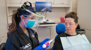Dental professional explaining procedure to a patient
