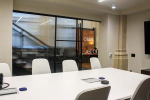 CosciaMoos HQ transformed by ZONA’s customizable glass partitions.