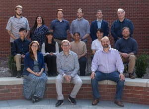 team sitting and standing