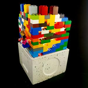 Funky building assembled with play bricks on Lampadabra luminaire