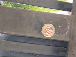 The Great US Treasure Hunt coin, hidden under a bench in public