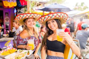 Friends enjoying Mexican Independence Celebration at La Mexicana Taco Bar