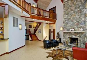 Upscale home for sale in Cabin John MD with cathedral ceilings, on a sloped lot