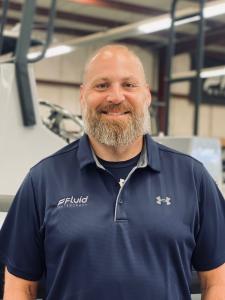 man standing by patrol boat