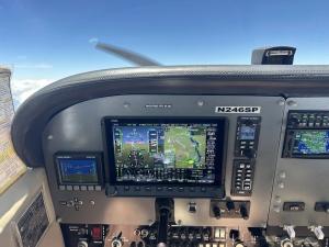 Cockpit view of a Cessna 172 TAA with advanced avionics, showing the glass cockpit displays and navigation systems.