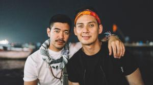 Two young Indian men posing together outdoors at night, with one man resting his arm on the other's shoulder, symbolizing connection and companionship in an intimate, supportive setting.