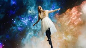 Matthew Blakemore as Australia's Kate Miller-Heidke, soaring on a swaying pole in a billowing white gown.