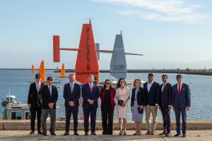 From left: Rep. Matt Gaetz, Rep. Carlos Gimenez, Saildrone CEO Richard Jenkins, Chairman Mike Rogers, Rep. Sara Jacobs, Rep. Nancy Mace, Rep. Jen Kiggans, Rep. Marc Veasey, Rep. Ro Khanna, and Rep. Rich McCormick in front of two Saildrone Surveyor USVs an