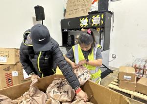 NOVA-FR Volunteers pack bags for their Backpack Program for food insecure students