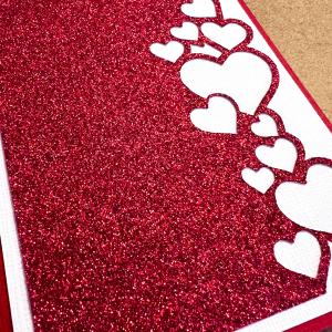 Bright and sparkling red cardstock with a luxurious glitter finish, perfect for crafts and creative projects.