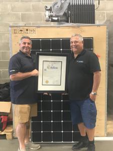 Scott Maskin and Mike Bailis pose with the Town of Islip Citation