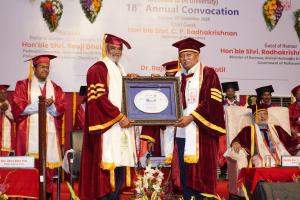 A well-deserved recognition: Dr. Savjibhai Dholakia was honoured with a certificate by Dr. Rajendra Vikhe Patil, President and Chancellor of PIMS