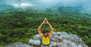 Woman doing yoga in Thailand mountains