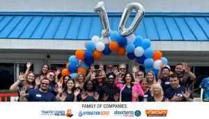 Photo of employees of OES Global Inc. in Pompano Beach, Florida celebrating the company's 10th Anniversary.