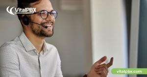 image of a person with glasses and headsets on a customer suppor environment