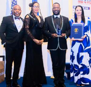 Ambassador Hugues Sanon and his spouse, Emmanuella Sanon, alongside Chairman Bernard George of NB4HS and emcee Mrs. Grace Gonzalez, accepted multiple prestigious awards.