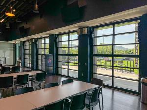 Sleek Renlita bi-fold doors enhance Heritage Financial Park's modern design and functionality.