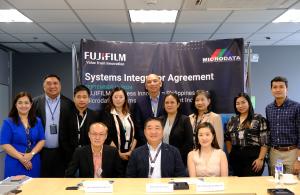 The teams of FUJFILM BI PH and Microdata Systems pose for a photo after the successful signing event