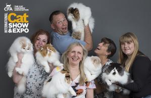 A group of dedicated cat enthusiasts gather at the prestigious CFA International Cat Show and Expo in Cleveland proudly cradling a Persian Cats.