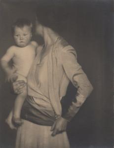 A 1928 black and white portrait by Dorothea Lange, of Gertrude Clausen and her infant Virginia